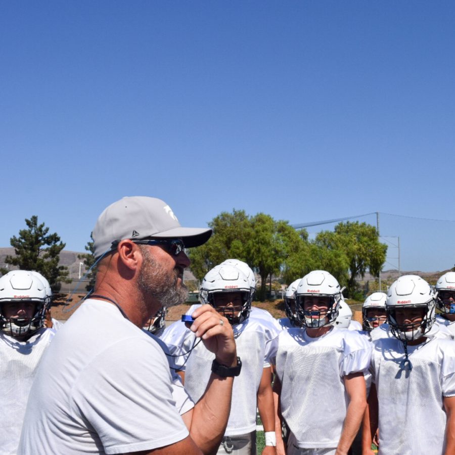 TIME-OUT: Coach Nobles provides advice to his athletes to help foster a successful season.