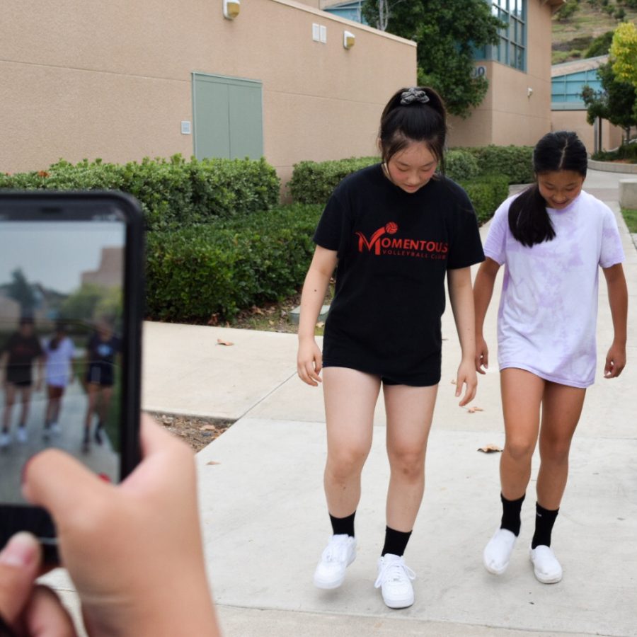 CAN’T STOP WON’T STOP: (left to right) Freshmen Ariela Kao, Lindsey Kung and Neela Michaelsen practice for their new TikTok video.