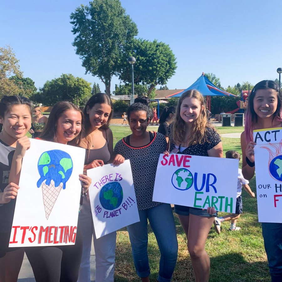 “THERE IS NO PLAN(ET) B”: Seniors with homemade posters protest climate change at Tustin Centennial Park.