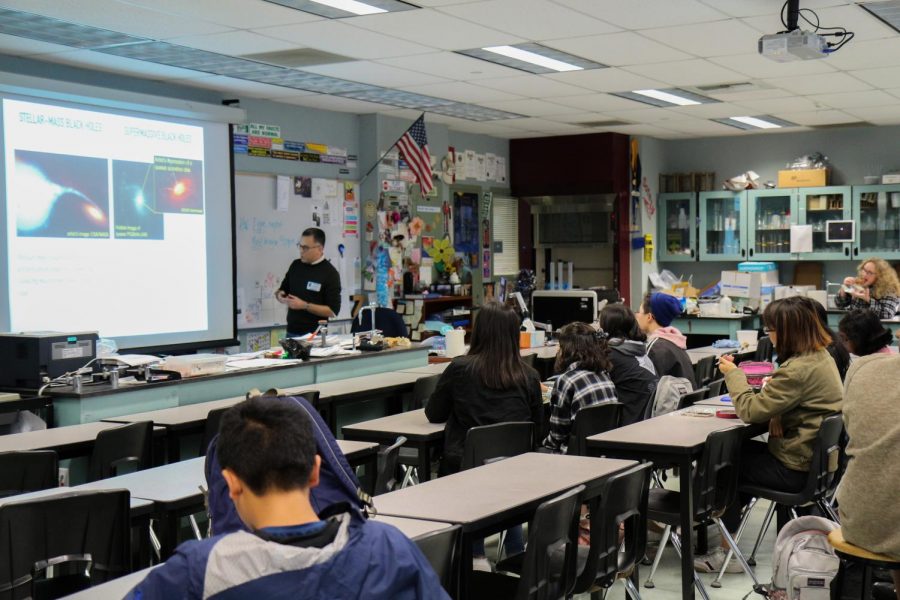 AN OUT-OF-THIS-WORLD MEETING: Astronomy Club members learn about black holes during lunch from a guest speaker.