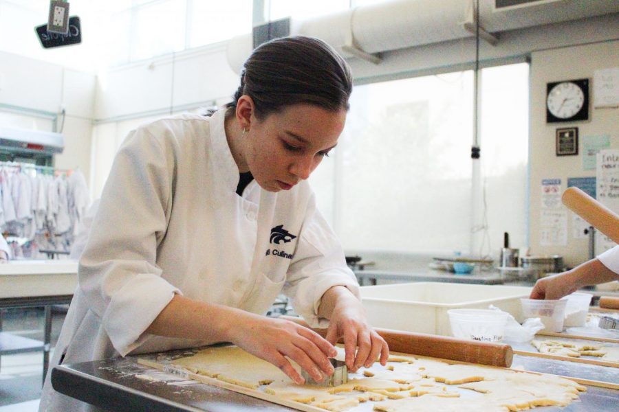 MAKING DREAMS CRUMB TRUE: Senior Alina Catiller finds her
passion in culinary arts and works hard to bake a perfect batch of cookies.