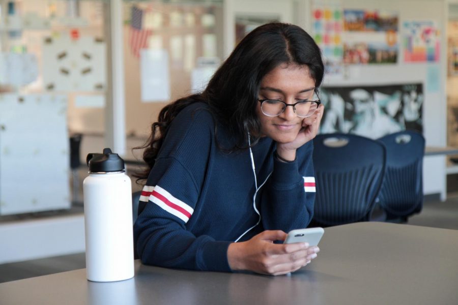 ORIGINAL OR INSPIRED?: Sophomore Gayatri Kalyan listens as she compares the classical and modern versions of two songs.
