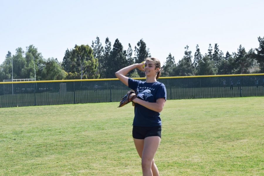 BATTER UP: Junior Kamryn Scott perfects her pitching technique.