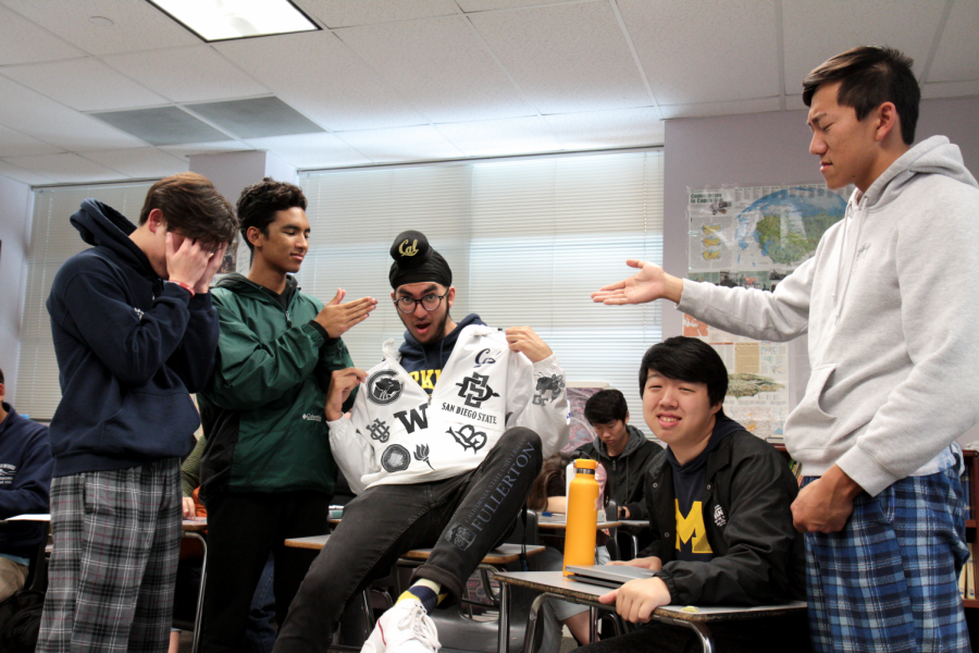 COLLEGE CRAZE: Senior Ekas Chawla disrupts peaceful AP Government class, annoying seniors (left to right) Ian Baick,
Adrian Fontao, Eric Lin and David Xue with an ostentatious college flex. Do not disrupt AP Government. Do not be Ekas.