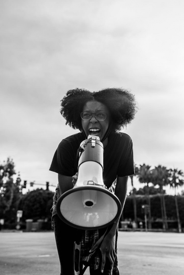 LET ME TALK: Northwood graduate Tori Oriola uses a megaphone to amplify her voice, as she spreads awareness about the Black Lives Matter movement in one of the rallies she attended. 