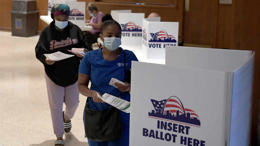 People continue to cast their ballots in-person during the primary election despite the pandemic.