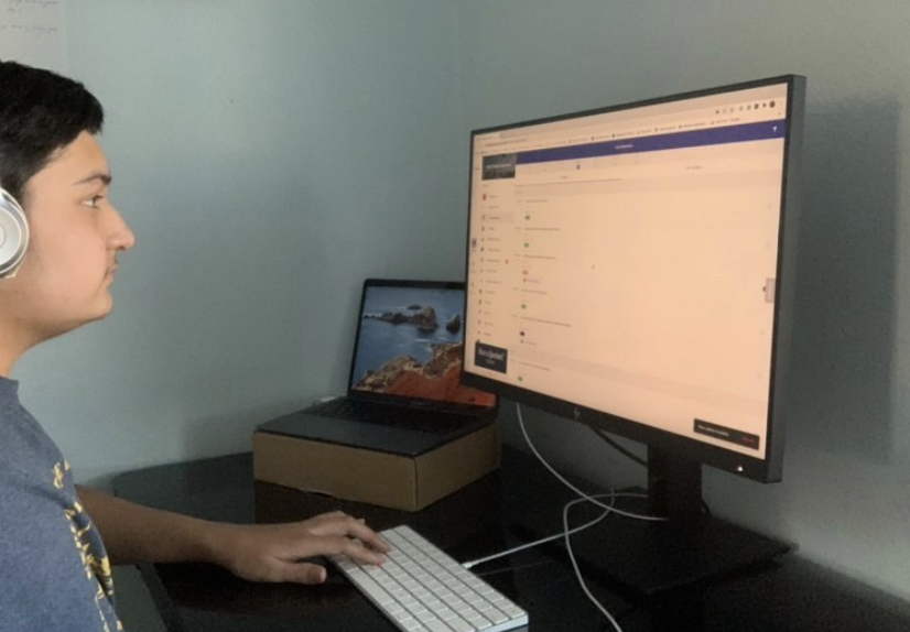 REWIND: Junior Mihir Joshi visits the Vital Link desktop browser after the College and Career Fair to rewatch one of the workshops that he missed.