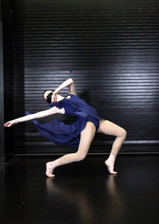 ELEGANCE: Senior Anessa Davies Pier begins a bent-legged lunge with a back arch outside of the dance room.