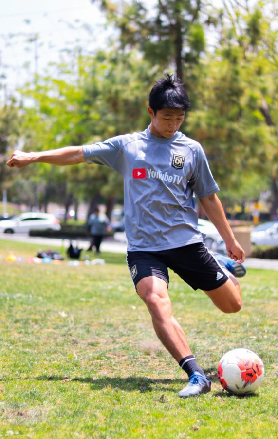 SHOOTING FOR THE STARS: Son aims to score during practice.  