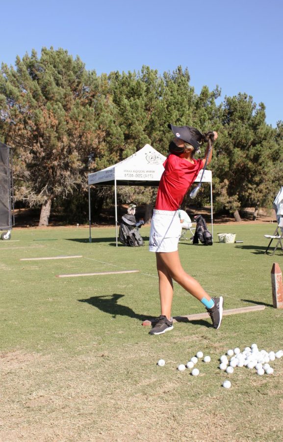 SWINGING SEASON: Sophomore Jia An perfects her putt while practicing for an upcoming match.