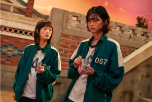 MOMENT OF FRIENDSHIP: In one of the only hopeful scenes of the series “Squid Game,” players Sae-byeok and Ji-yeong play a round of marbles after spending time sharing their life stories. 
