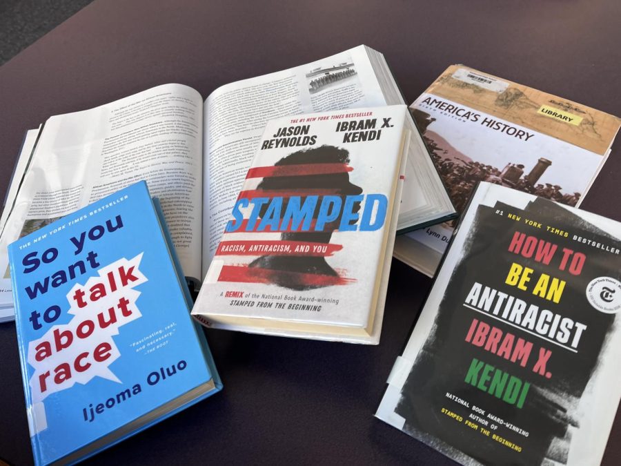 SUPPLEMENTAL SELECTIONS: Piled on textbooks are other reading material on Black History and antiracism, available at Northwood’s school library.