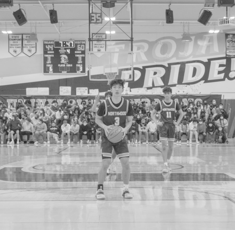 HE+SHOOTS%2C+HE+SCORES%21%3A+Senior+Devon+Huang+readies+himself+to+shoot+a+free+throw+at+an+away+game+against+University+High+School.