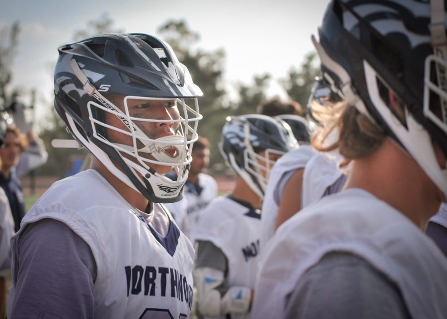 Senior Jake Nguyen watches intently along with others as his teammates outplay Irvine High School during Northwood’s senior night on March 30.
