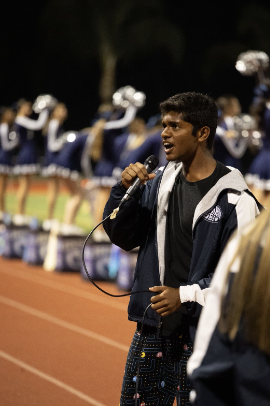  Boys Athletics commissioner, Aditya Hari gets the crowd hyped up before a football game. 