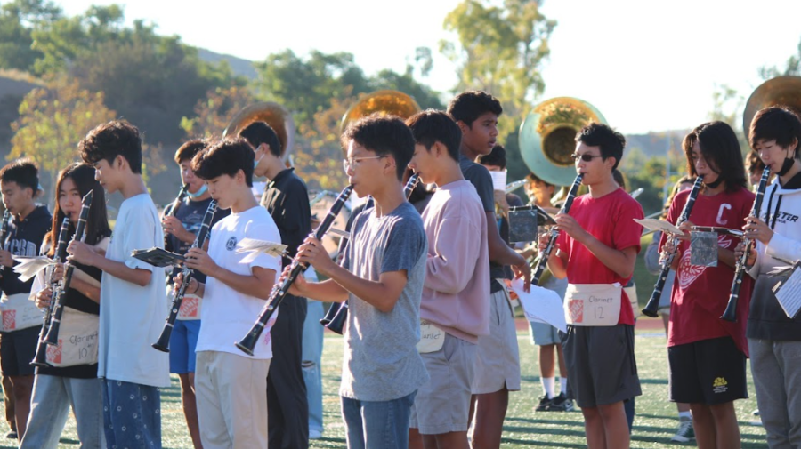PRACTICE MAKES PROGRESS: The clarinet section spread out during morning practice to warm-up with scales and learn the new notes for their set.   