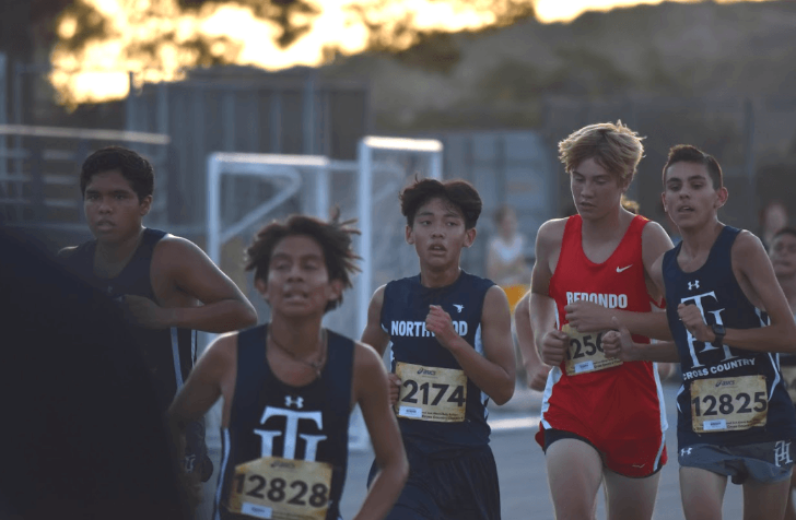 GO THE DISTANCE: Junior Kenny Kamikawa weaves through the competition during the JV boys race  at the Saddleback Cup Challenge. 