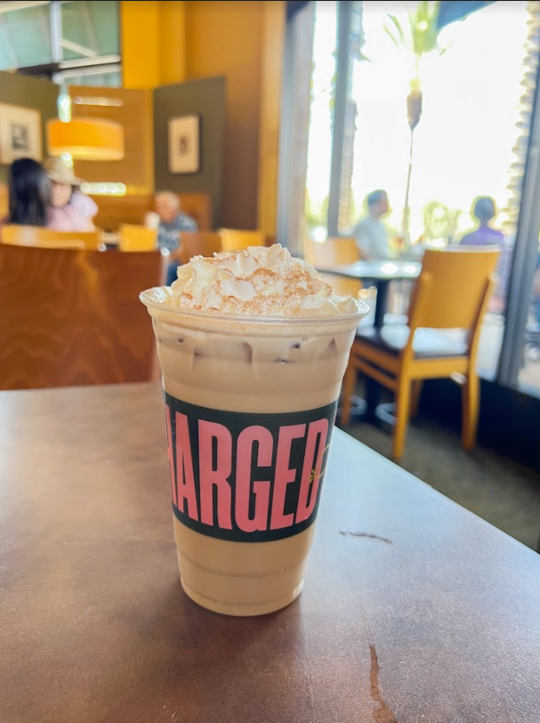 “Freshly brewed espresso, milk and cinnamon syrup topped with whipped cream and cinnamon sugar served over ice.”