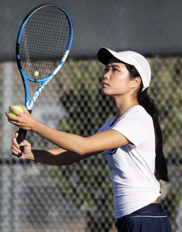ON PACE FOR AN ACE: Senior Paula Zhang concentrates intensely on creating a fluid motion for her serve in the CIF Quarterfinals.