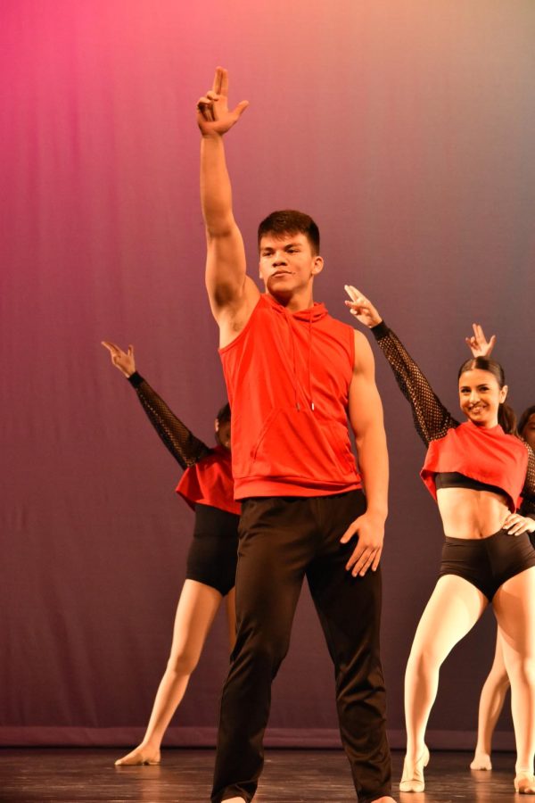 STRIKE A POSE: Junior David Grannis-Vu steps onto the dance

floor with moves he choreographed himself at the “Extensions” show.