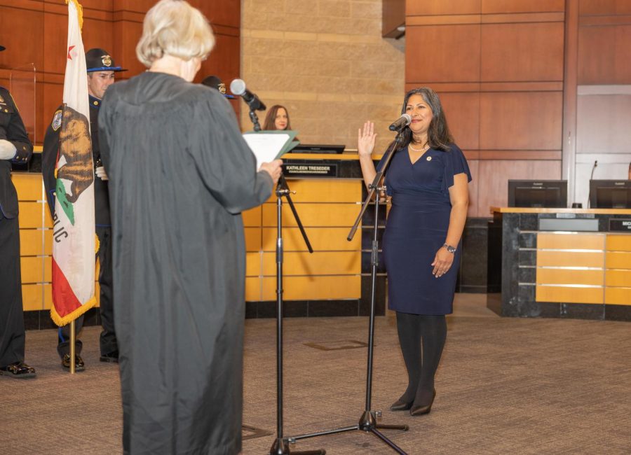 IT’S ALL UP TO THE VOTERS: Irvine mayor Farrah Khan is sworn in for her second two-year term in a December ceremony. If the district election system is passed, mayor would be the only candidate to run at large.