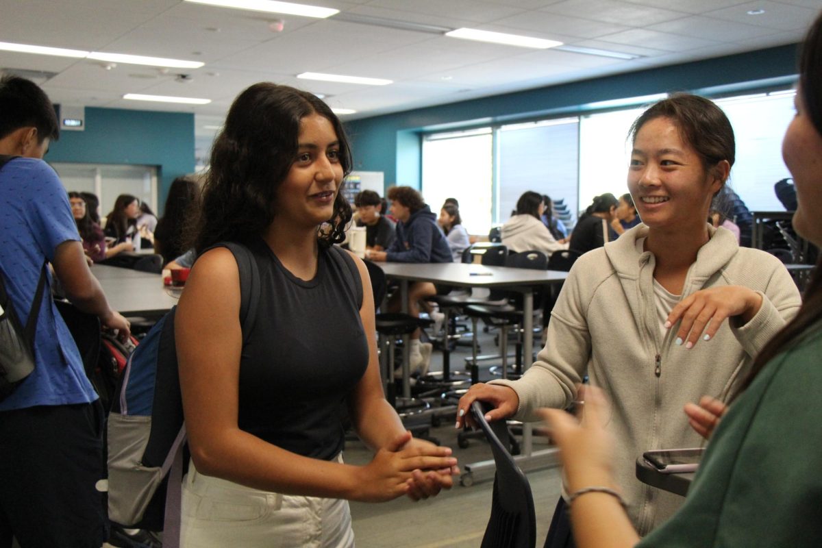 THE POWER OF WORDS: Sophomore Luna Bouhairi discusses the joys of participating in speech and debate with board member senior Sabrina Tang.