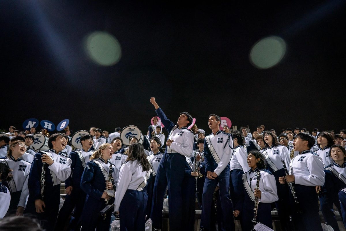 AN ENSEMBLE OF ENTERTWINIG ELEMENTS: The Northwood Marchig Band is a force to be reckoned with as they holler in the stands.