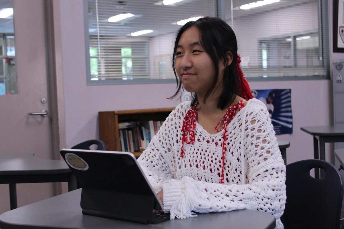 PICTURE PERFECT PRESIDENT: Poetry club president Saya Ryu perfects her poems, pondering about the pictures she can paint through her words.