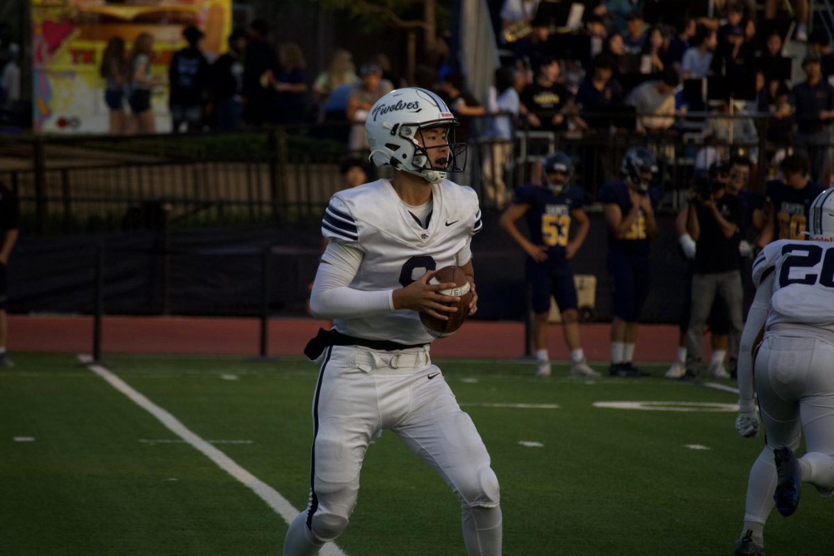 WARRIOR TO WOLF: Quarterback Eddie Ma looks to connect with teammates against Crean.