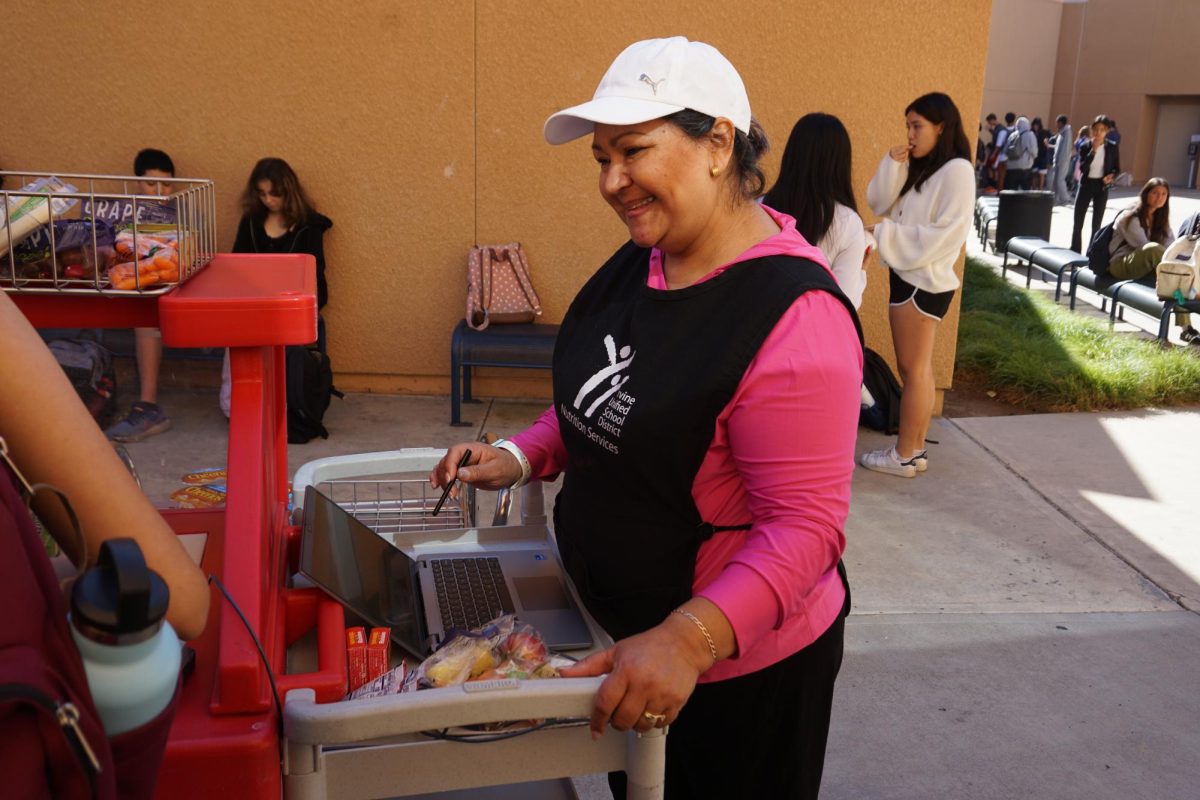 FALL-TASTIC FOOD: Nutritional services staff member Marylu Villalobos supplies nourishing snacks at break with a warm smile.