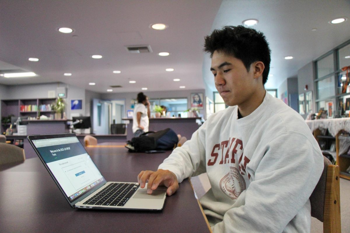 COUNTING THE COST: Senior Matthew Morikawa reviews last years FAFSA to prepare for this years new application opening.