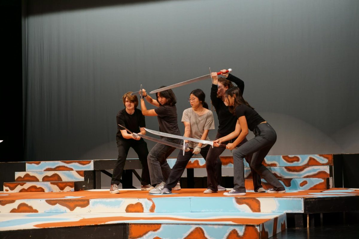 SLAYING THE STAGE: Actors practice their dragon formation in fight call rehearsal.