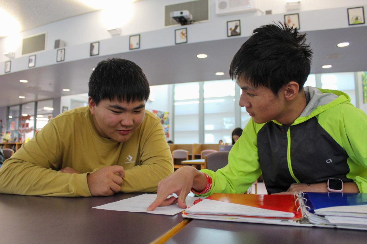 Junior Kenny Zhang and freshman Tony Wen use effective study methods, such as the Pomodoro method and spaced repetition, to solve problems during tutorial.