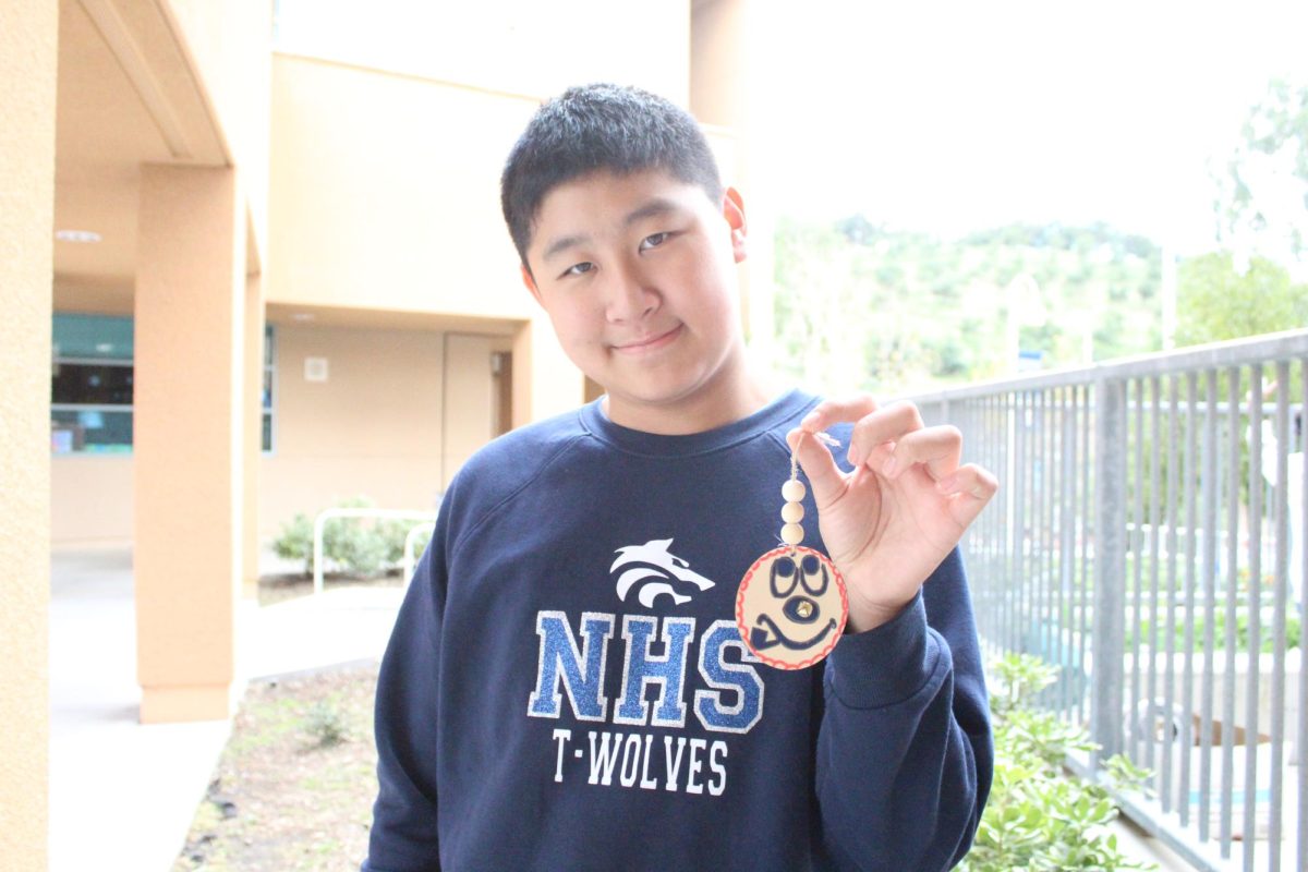 SHARING SMILES: Sophomore Tony Nakayama displays the crafts that were made with love and care.