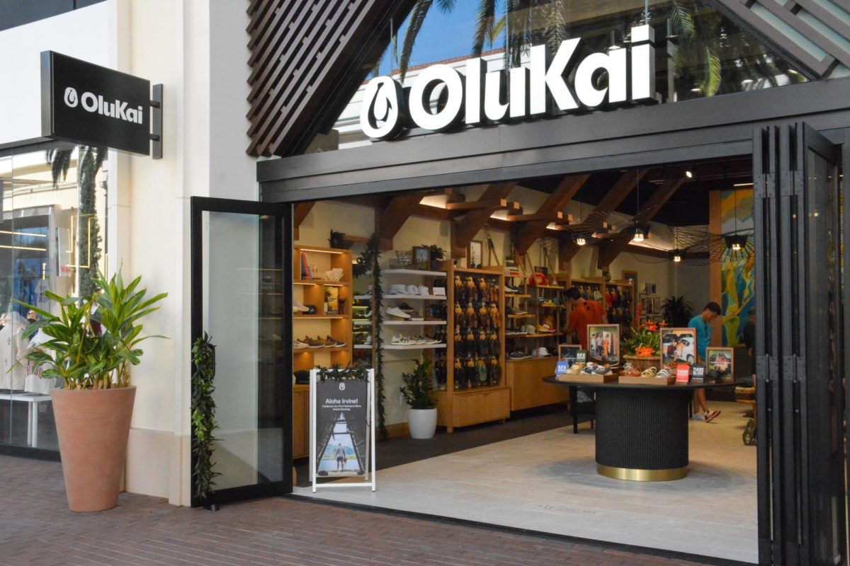  NEW TO IRVINE: Shoppers take a look at the new OluKai storefront at the Irvine Spectrum.