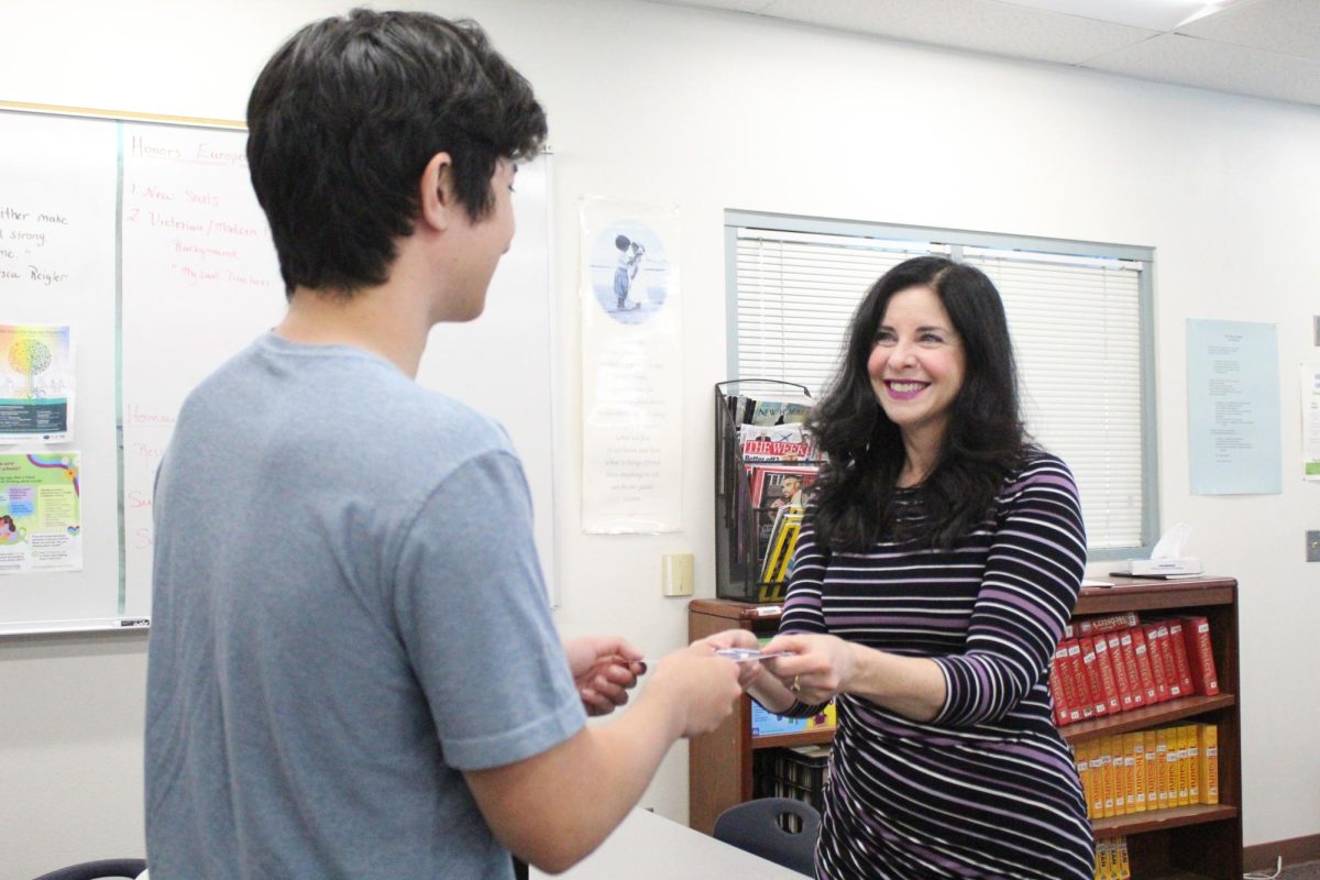 THANKS THAT THRILL: English teacher Sara Katlen lights up a student’s day with a T-wolf Thank You.