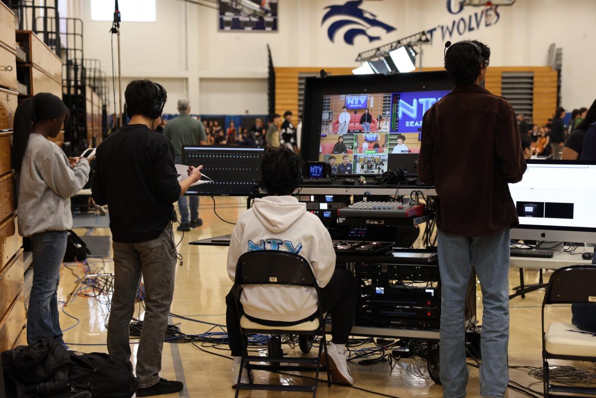 FILMING IN ACTION: NTV members utilize their film skills at the Fine Arts Assembly. 