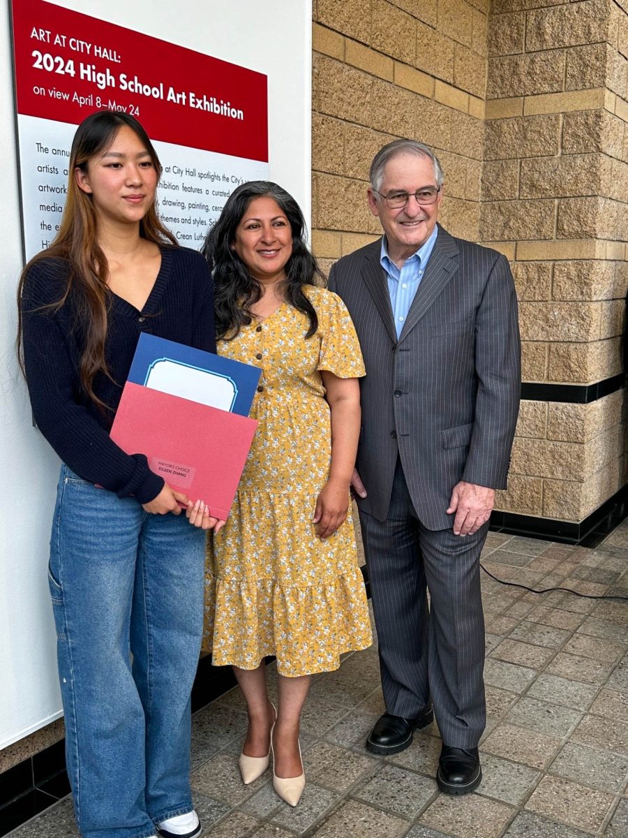 MAYOR’S CHOICE: Vice Mayor Larry Agran, Mayor Farrah Khan and award winning sophomore Eileen Zhang pose at the opening reception of the Irvine City Hall High School Art Exhibition.