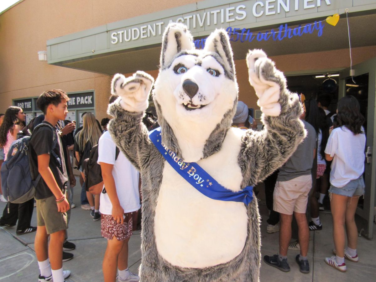 BIRTHDAY BASH IN A SASH: Timby celebrates his 25th birthday as students line up for free ice cream sandwiches distributed by ASB.