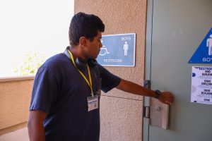 THE NEW PASSES: Senior Anton Kingsley wears the bathroom pass around his neck in order to use the restroom during class.