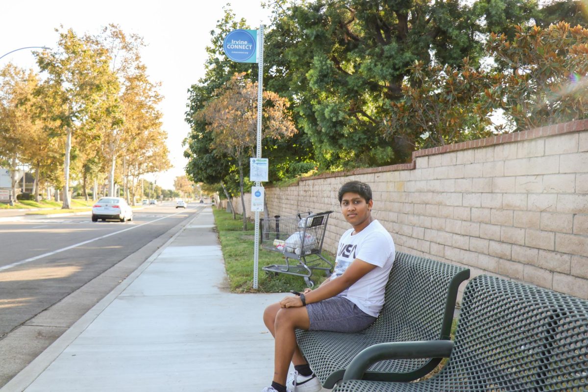 SEAMLESS SHUTTLE CONNECTIONS:  Senior Pranit Prabhakar waits for the Irvine CONNECT Shuttle.