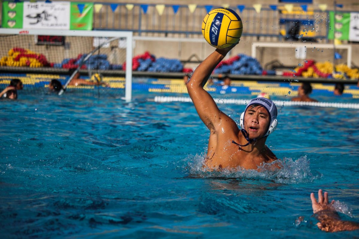 MAKING WAVES: In a match against El Toro High School, varsity water polo captain senior Gavin Dang aims to score, putting his team ahead in the game and securing a landslide 20-1 victory