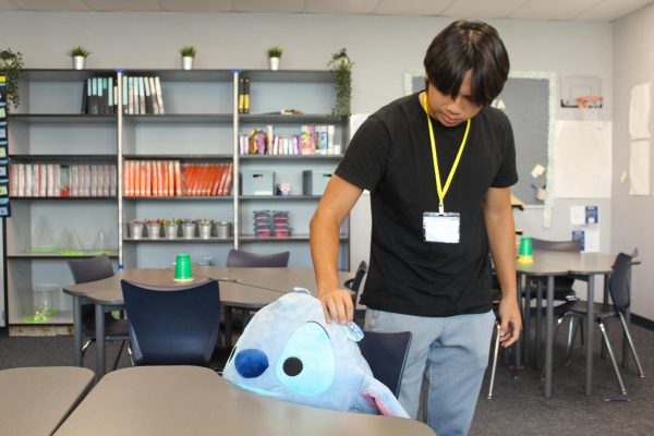 SAVE MY SEAT STITCH: Senior Russell Nguyen leaves Mrs. Wells’ Stitch plushie in his seat in order to grab the bathroom pass.