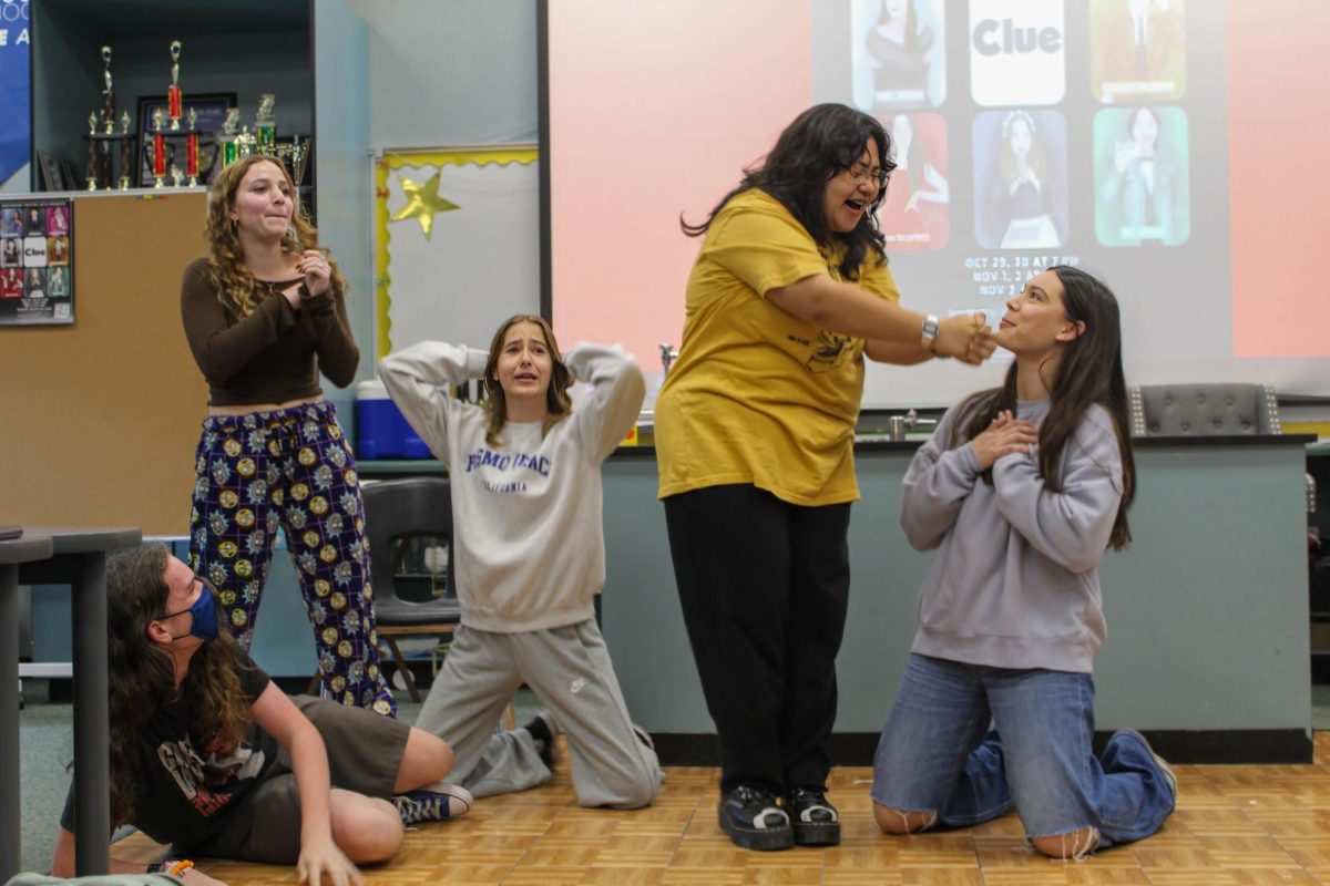 EXPRESSIONS AND IMPRESSIONS: Members of Northwood’s Improv Club play a game of “Remote Control,” in which actors improvise dialogue to fit spontaneous settings and locations called out by the audience.