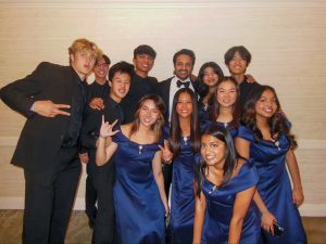 MELODIES AND MEMORIES: Sameer Gadhia of Young the Giant joins Northwood Chamber students for a quick picture after their performance.