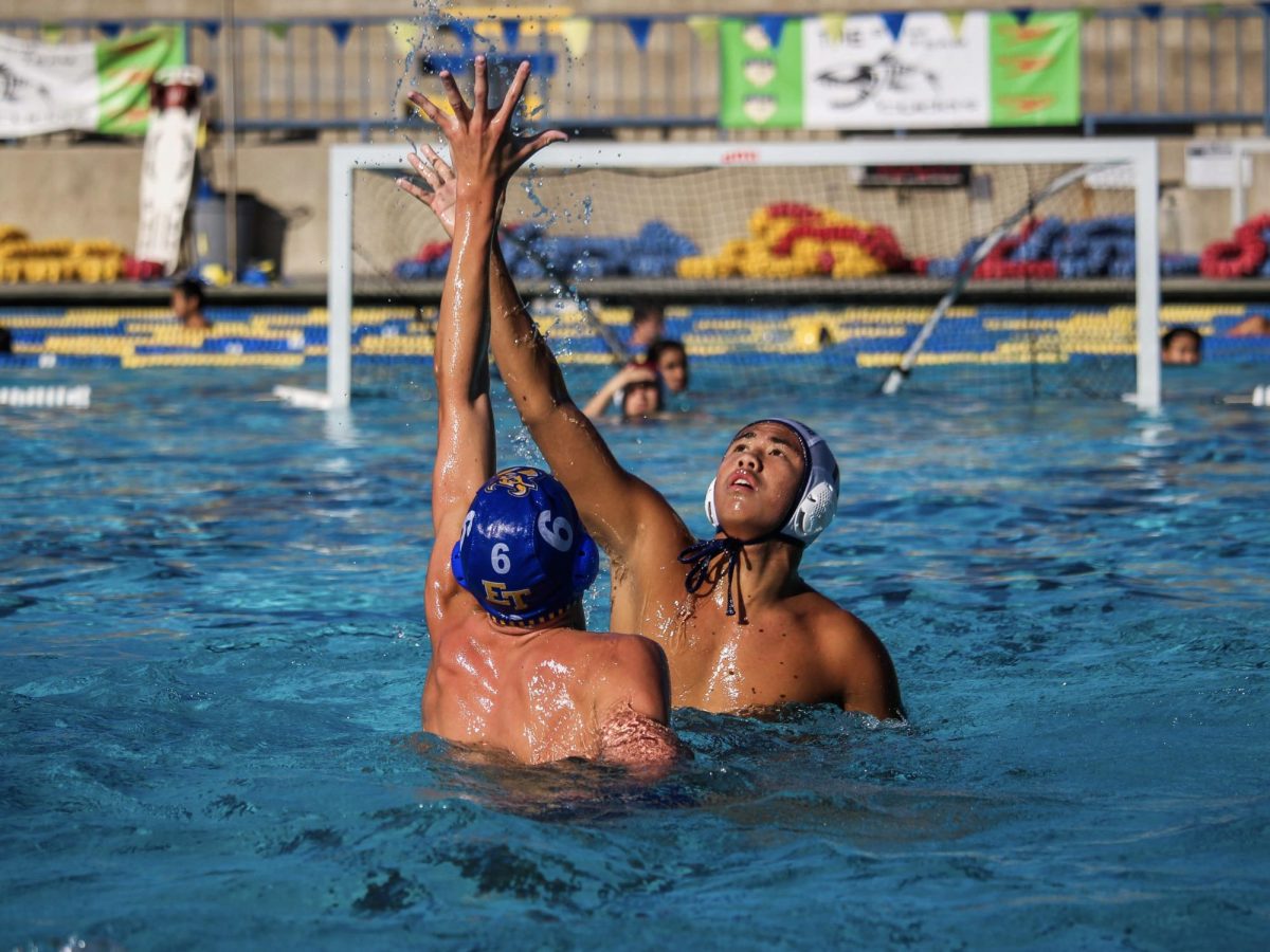 IN THE DEEP END: Varsity water polo goalkeeper junior Sidney Francisco De Paula Junior contests against El Toro High School as he lines up for a strategic throw. 