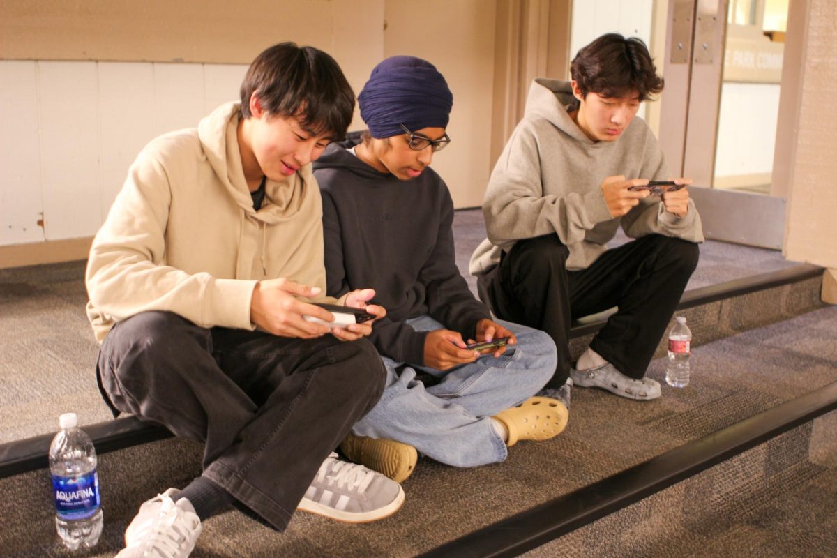 READY, SET, BRAWL: Northwood freshmen Kevin Chen, Manvir Kalra and Evan Jung plan their strategy for the next round of the tournament