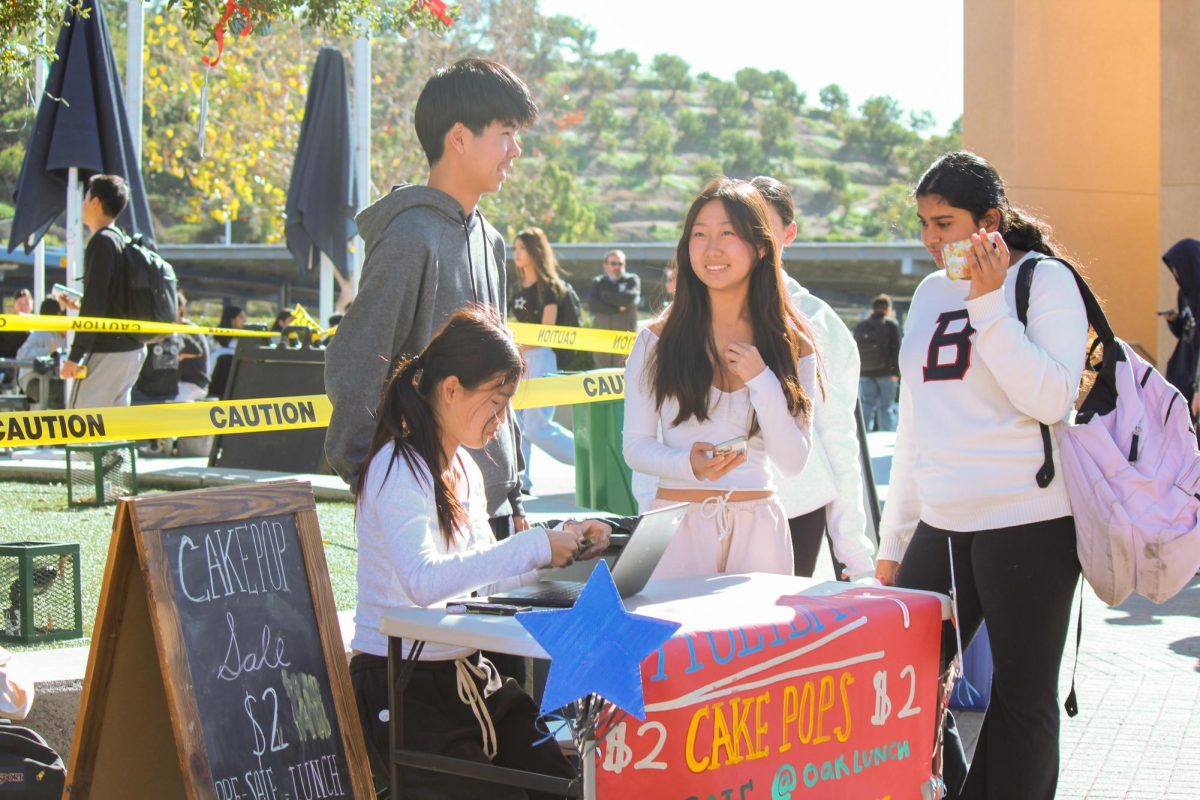 SETTING THE STAND: Freshman Class Council members Carson Lv, Bella Shim, Abbie Kim and Mischka Rajula set up their Cake Pop Stand during lunch.