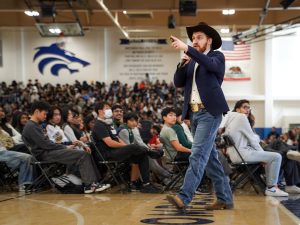 COWBOY COOP: Dallin Cooper, Tedx Talker and guest speaker, gives a speech to advocate for student’s mental well-being and confronts microaggressions during an assembly in the MPR. 