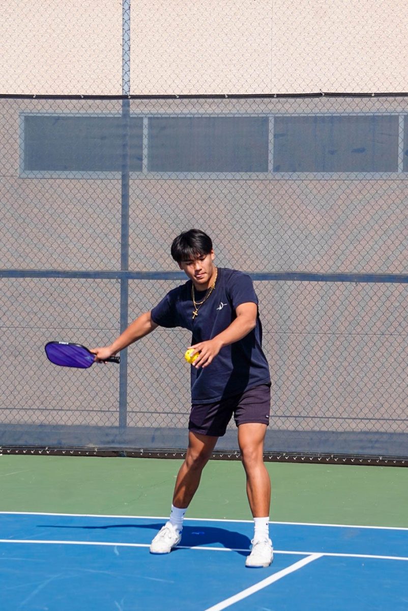 ACE IN ACTION: Junior Jack Schultz dominates the pickleball court with a sharp serve.